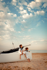 Portrait of young sailors near yacht