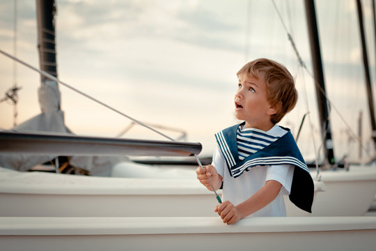 Portrait of young sailor near yacht