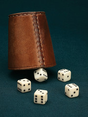 Five dice and leather cup