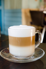 Hot coffee latte on wood table in the cafe