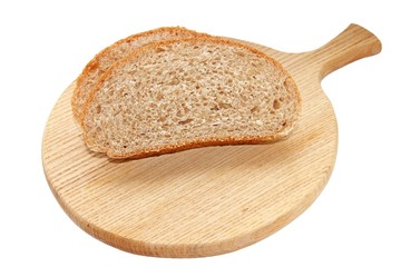 Pieces of bread with bran on the Board from oak