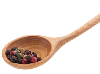 Pepper seasoning  mix in wooden spoon isolated on white backgrou