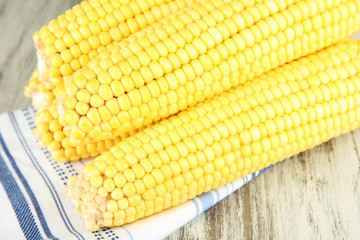 Crude corns on napkin on wooden table