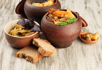 Homemade beef stir fry with vegetables in pots