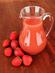Delicious strawberry juice on table close-up