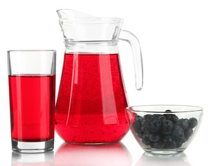 Pitcher and glass of compote isolated on white