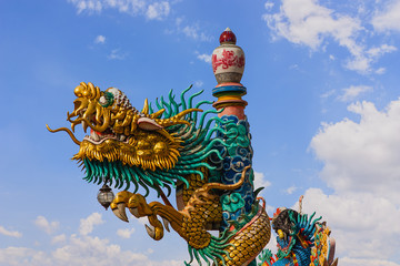 Dragon statue with beautiful clouds and blue sky