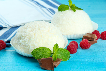Delicious coconut cakes on table close-up