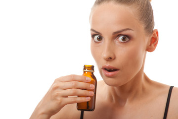 woman smelling bottle