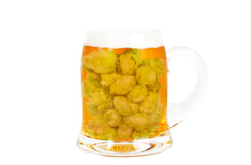 Glass of golden beer full of hop