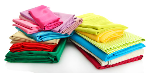 heap of cloth fabrics isolated on white