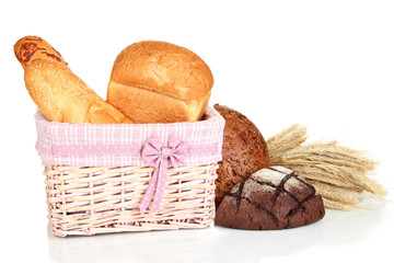 Baked bread in wicker basket isolated on white