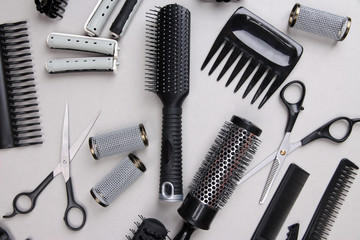Professional hairdresser tools on gray background