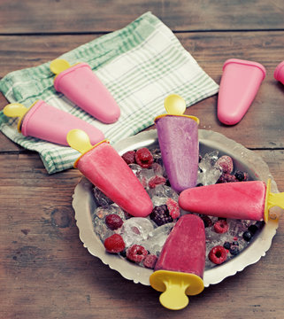 popsicles on rustic wooden table