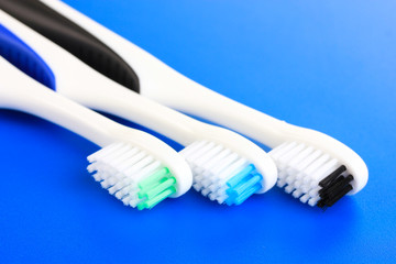 Tooth-brushes on blue background