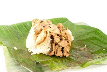 stick rice with pork wrapped in banana leaves
