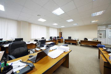 Light and spacious office with work desks, computers