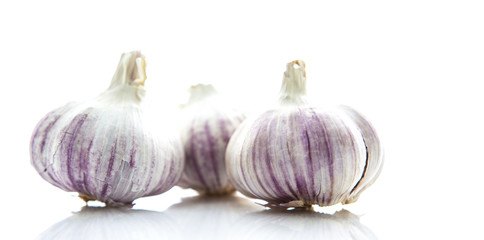 Garlic bulbs on white background