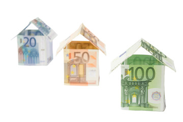 Three houses made of euro notes