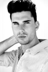 Black and white portrait of an attractive male fashion model