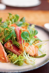 Appetizer with rare fried tuna and salmon