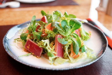 Appetizer with rare fried tuna and salmon