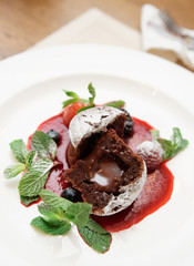 Chocolate fondant with berry sauce