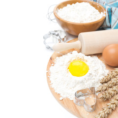 Fototapeta na wymiar baking ingredients - flour, egg and baking forms, isolated