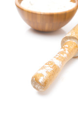 bowl with flour and rolling pin, selective focus, isolated