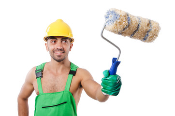 Painter in green coveralls on white