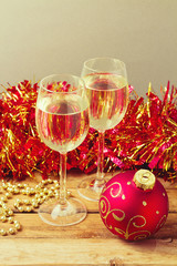 Christmas celebration with glass of champagne and ornamnets