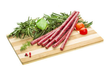 Salami with rosemary, basil and tomato
