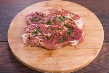 Raw steak with spices