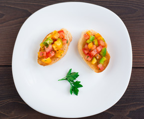 Delicious bruschetta with paprika and herbs