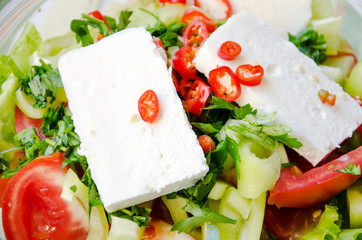 Ingredients for salad - white cheese, tomato, paprika, parsley