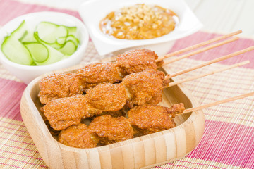 Malaysian chicken meatball satay, peanut sauce and cucumber