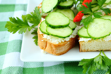 bruschetta with cheese and fresh cucumber