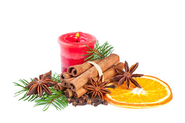 christmas decoration with fir branch, candle, cinnamon