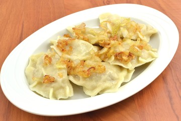 dumplings with meat, cabbage and onion