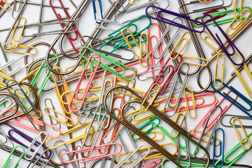 Assortment of paper clips on white surface