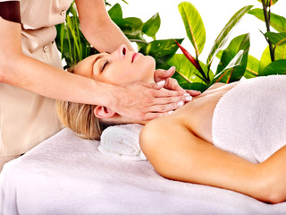 Woman getting  facial massage .