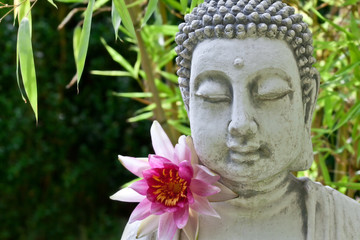 Buddha with lotus flower and bamboo leaves
