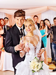 Wedding couple drinking champagne