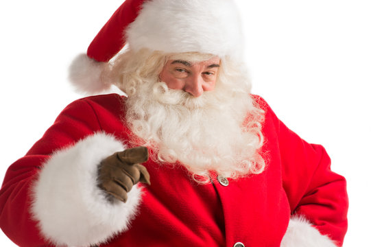 Portrait of happy Santa Claus pointing at you