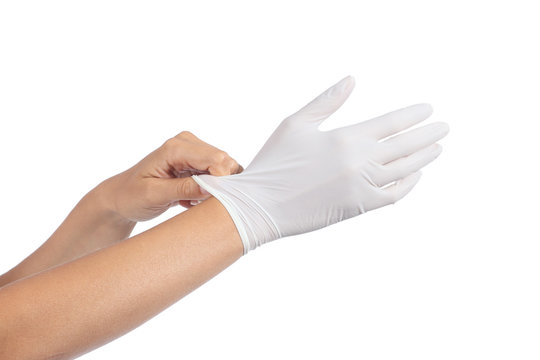 Woman hands putting on a latex gloves