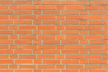 Obraz premium Red wall of bricks with grey seams