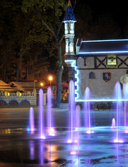 Fototapeta na wymiar Colored water fountain at night. Ukraine. Kharkov. Gorky Park.