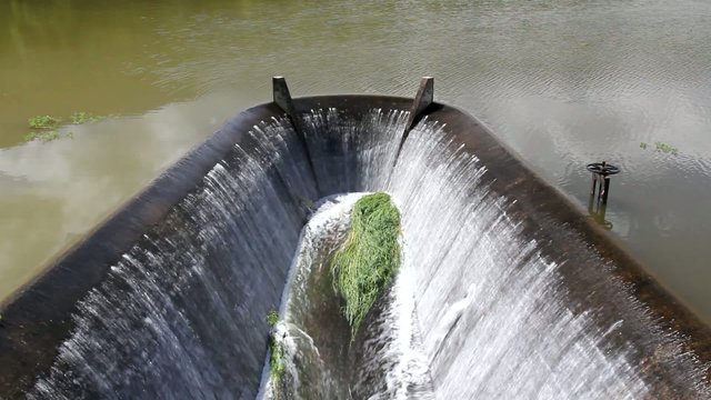 Water flowing from dam. lake.