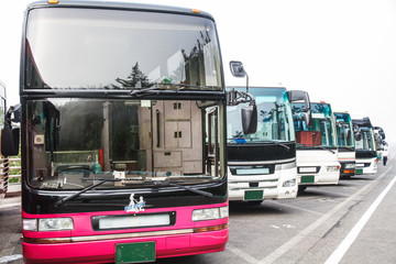 Many bus coach are lined up at the parking lot of Mount Fuji. © Masato