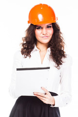 young beautiful woman in yellow construction helmet 